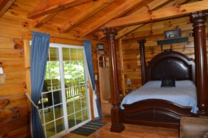 bedroom in The Landing log cabin