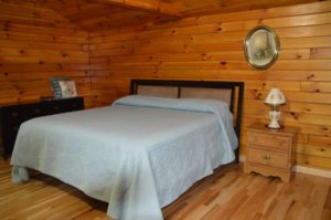 bedroom in The Overlook log cabin