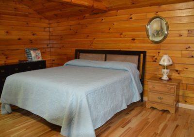 bedroom in The Overlook log cabin