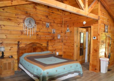 bedroom in The Lakota log cabin in Hocking Hills